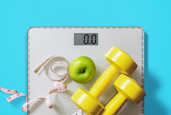 Bathroom Scale with weights, an apple, and tape measure